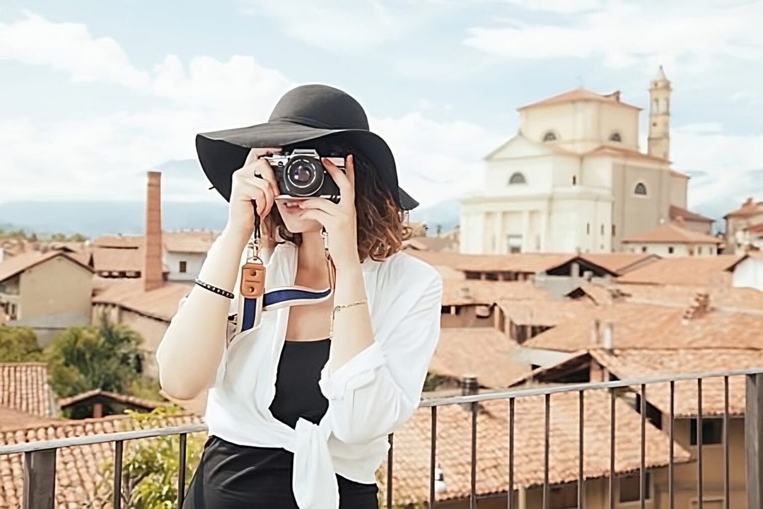 Photographer framing a shot of historic architecture on location